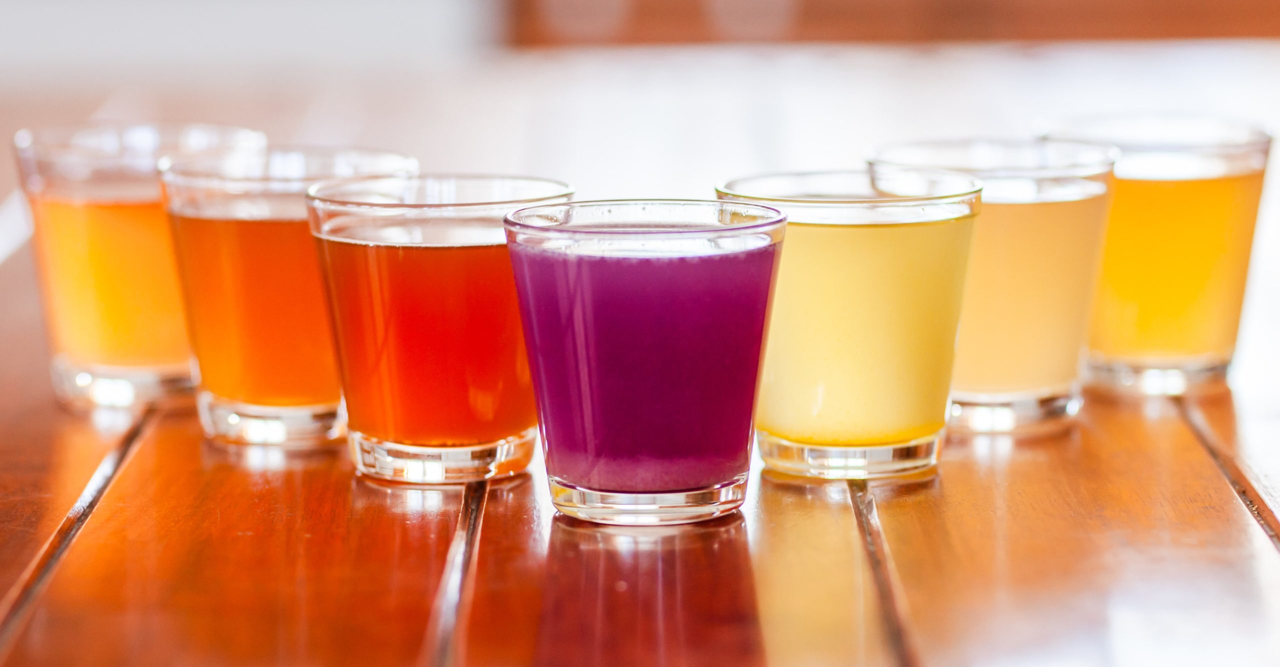 Colored glasses of flavored fruit kefir